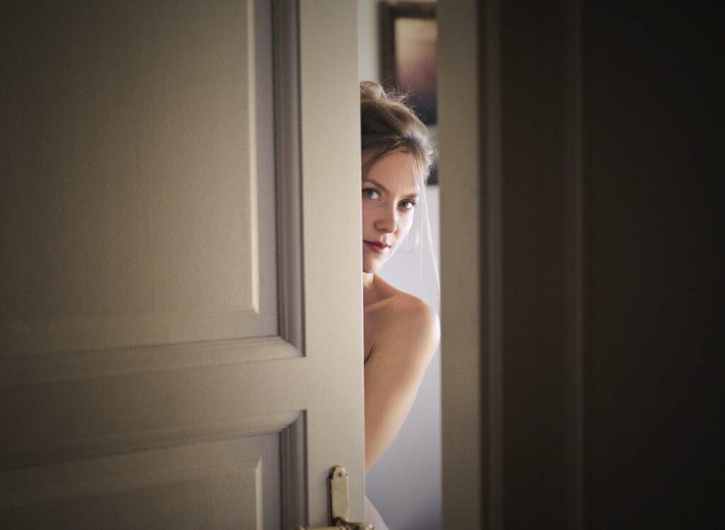 Photo of Woman Behind Door