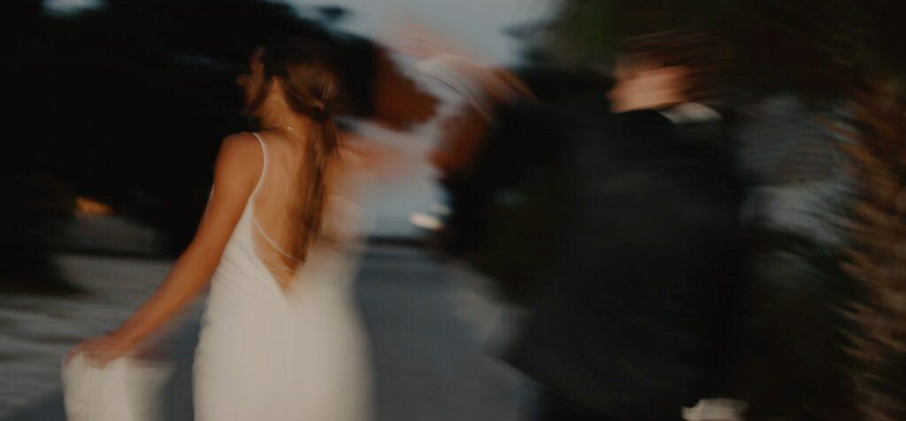 a blurry photo of a woman in a white dress