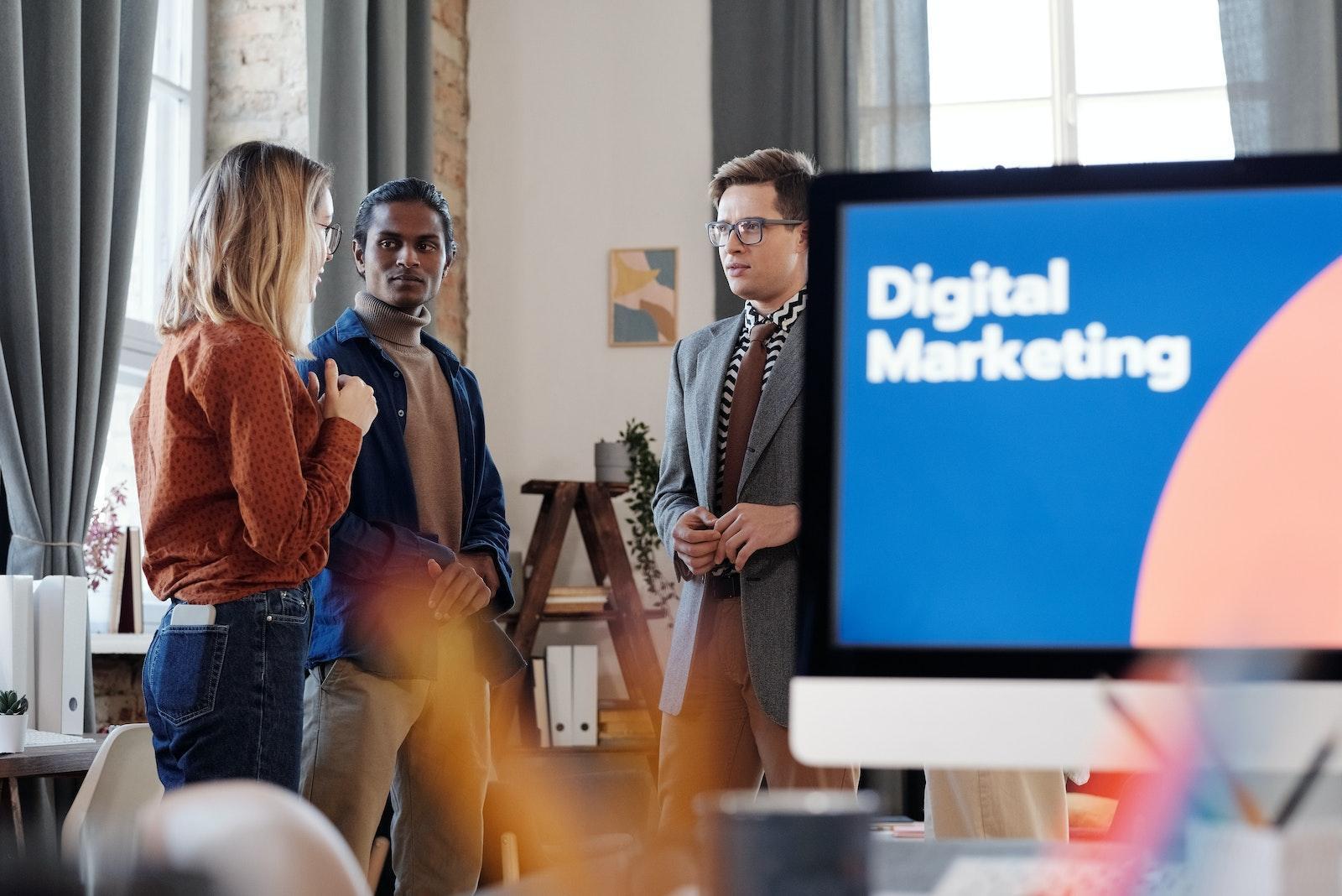 A Group of People Standing While Having a Discussion