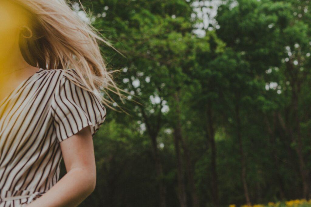 woman in white and black stripe shirt