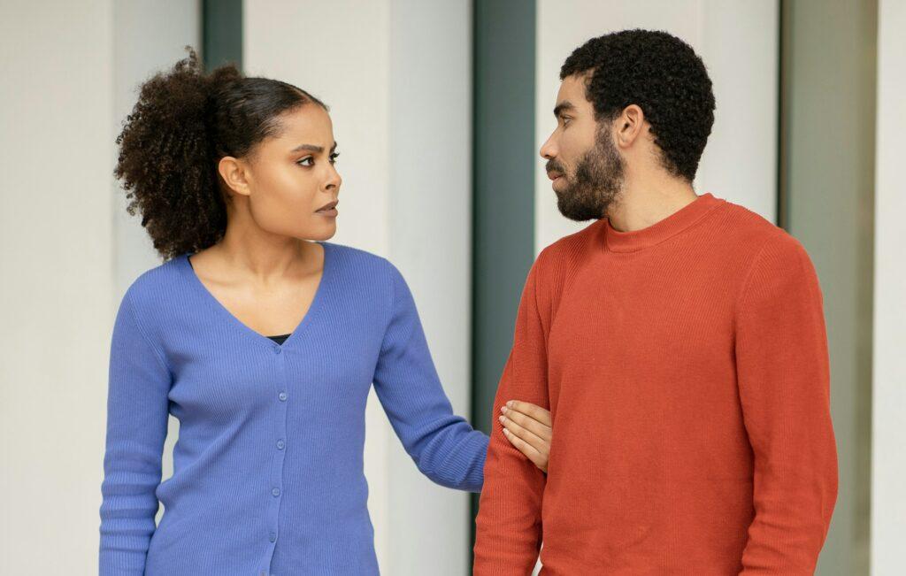 Diverse Married Couple Having Quarrel Breaking Up Standing Outdoors