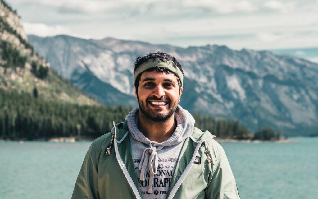 man in green zip up jacket