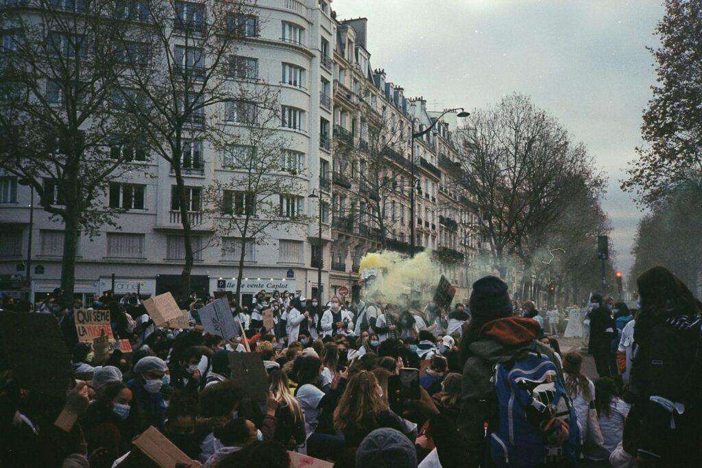 a crowd of people standing in front of a building