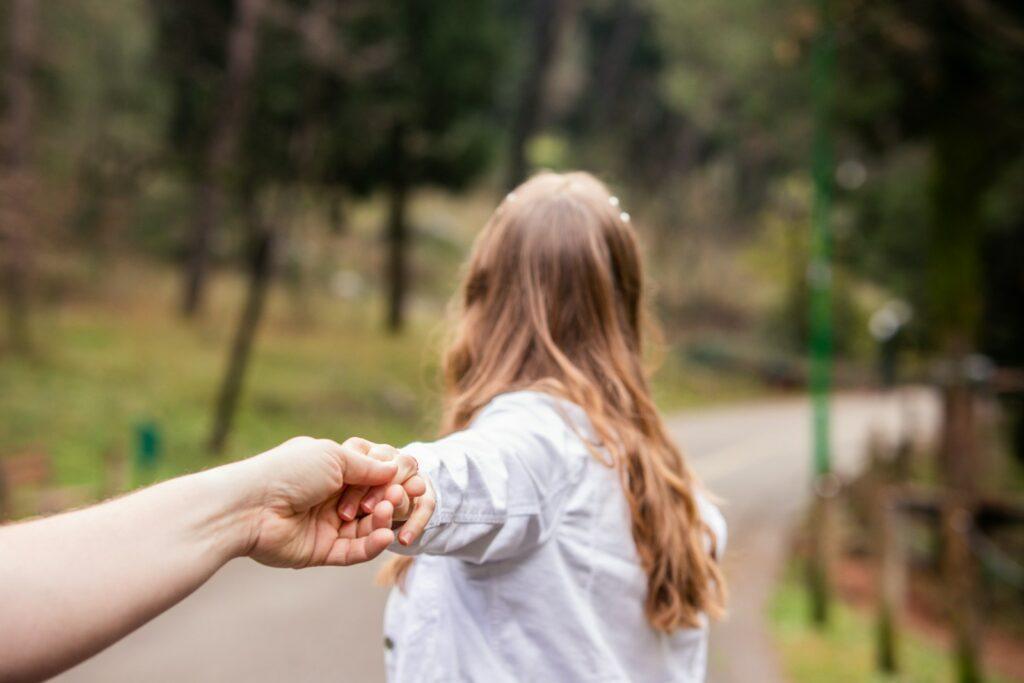 a person holding the hand of another person